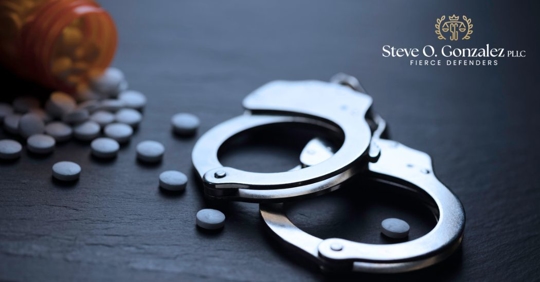 handcuffs and pills on a table